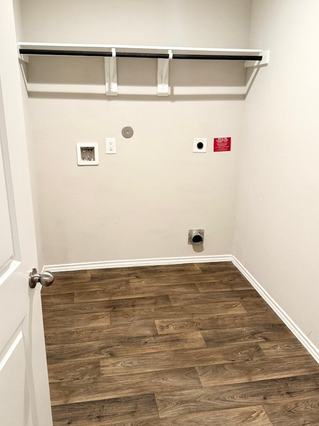laundry area featuring gas dryer hookup, hookup for a washing machine, laundry area, dark wood-type flooring, and electric dryer hookup