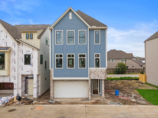 view of front of property featuring a garage