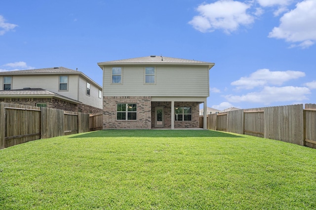 4334 W Bayou Maison Cir, Dickinson, TX 77539 - rear view of house featuring a fenced backyard and brick siding