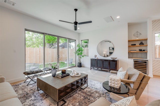 2113 Huldy St, Houston, TX 77019 - living area featuring beverage cooler, ceiling fan, baseboards, recessed lighting, and a bar