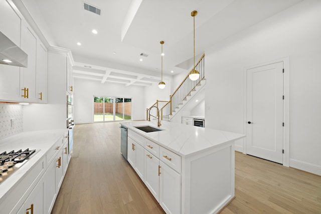 811 W 18th St, Houston, TX 77008 - kitchen with recessed lighting, light wood-style flooring, white cabinets, decorative backsplash, and appliances with stainless steel finishes