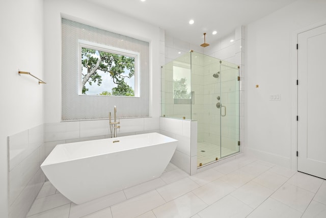811 W 18th St, Houston, TX 77008 - full bath featuring a soaking tub, a stall shower, tile patterned floors, and recessed lighting