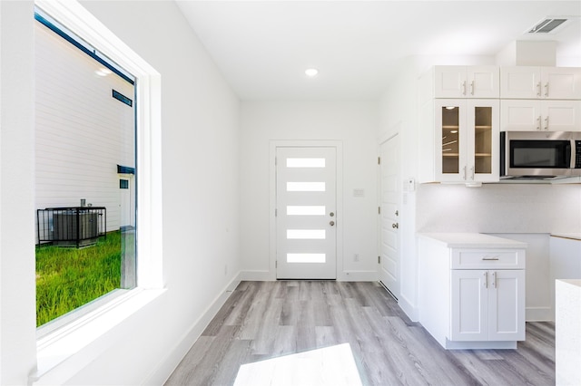 5304 Lynnfield St, Houston, TX 77028 - entryway with light wood-type flooring, baseboards, and recessed lighting