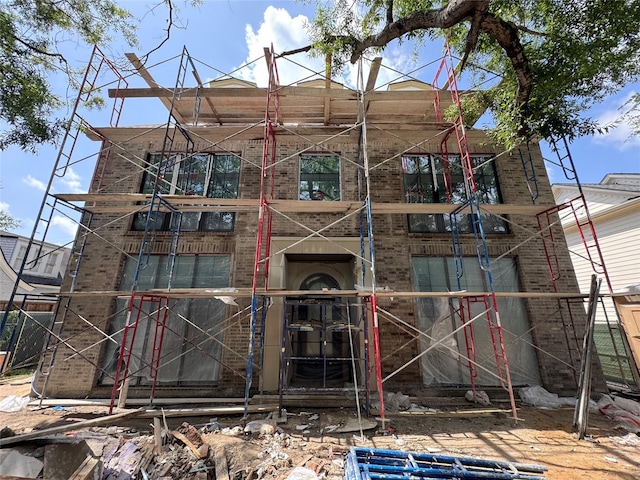 2217 Pelham Dr, Houston, TX 77019 - rear view of property featuring brick siding and a balcony