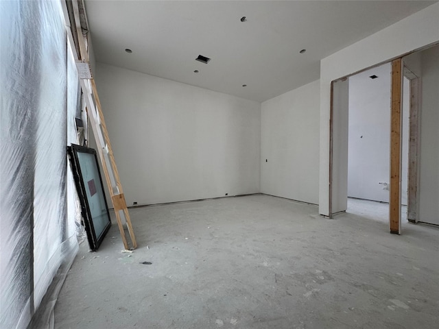 2217 Pelham Dr, Houston, TX 77019 - unfurnished bedroom with concrete floors