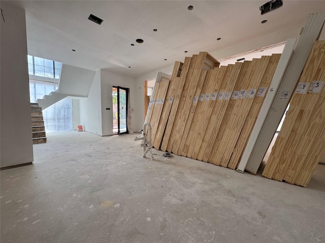 2217 Pelham Dr, Houston, TX 77019 - empty room featuring stairway and concrete flooring