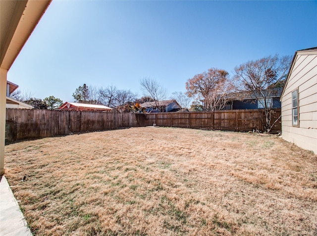 view of yard with a fenced backyard