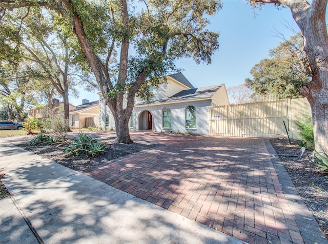 view of front of property with decorative driveway