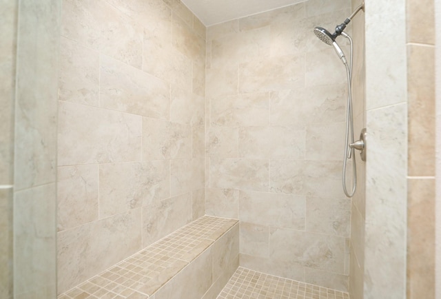 bathroom with tiled shower