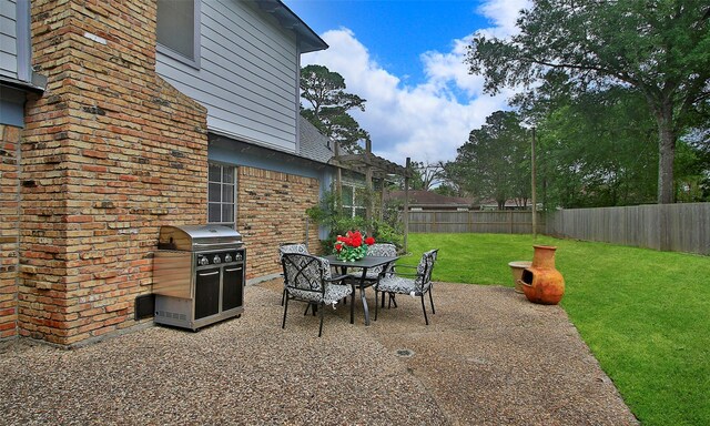 view of patio / terrace with area for grilling and outdoor dining space