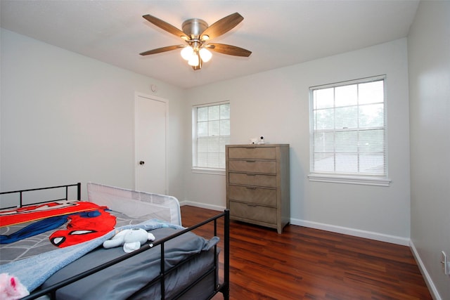 bedroom with wood finished floors, baseboards, and a ceiling fan