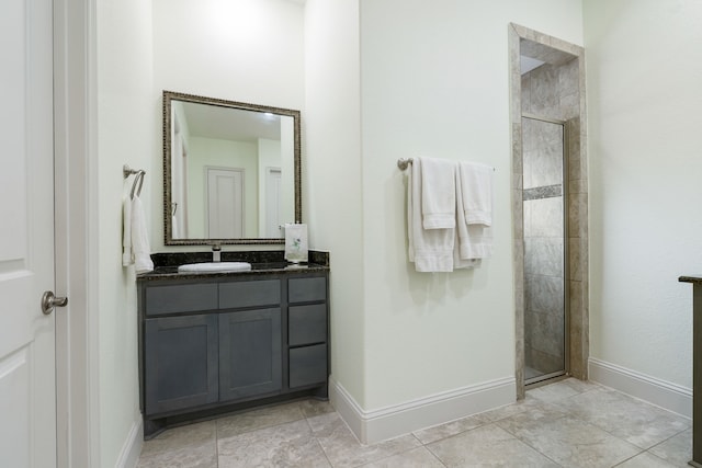 114 Pacific Grove Dr, Montgomery, TX 77316 - full bathroom featuring baseboards, a shower stall, tile patterned flooring, and vanity