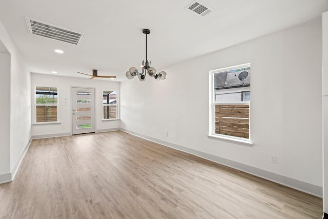 1009 Genova St, Houston, TX 77009 - unfurnished dining area featuring wood finished floors, a chandelier, recessed lighting, and baseboards
