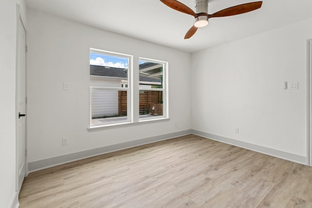 1009 Genova St, Houston, TX 77009 - empty room with light wood-style floors, ceiling fan, and baseboards