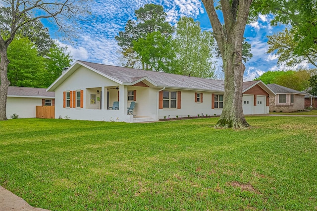 28779 Aloha Ln, Conroe, TX 77356 - view of front of property featuring stucco siding, a front yard, and an attached garage