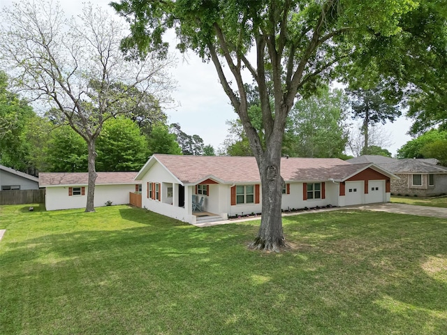 28779 Aloha Ln, Conroe, TX 77356 - single story home featuring a front lawn, stucco siding, concrete driveway, an attached garage, and fence