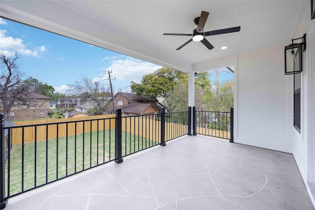 balcony with a patio and a ceiling fan
