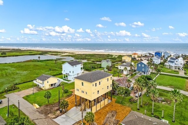 aerial view with a water view, a beach view, and a residential view