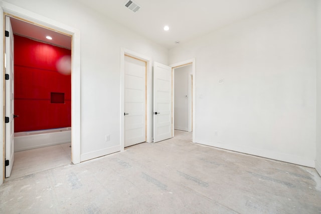 unfurnished bedroom with baseboards, visible vents, and recessed lighting