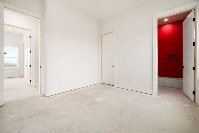 unfurnished bedroom featuring baseboards and recessed lighting