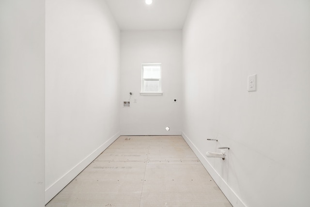 laundry area featuring baseboards, laundry area, and hookup for an electric dryer
