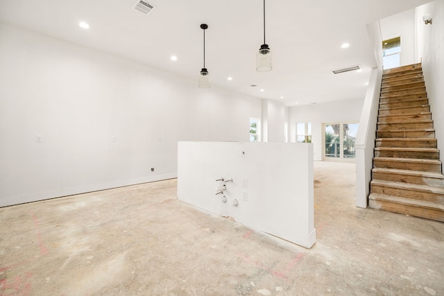 interior space featuring stairway, concrete flooring, baseboards, visible vents, and recessed lighting