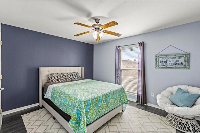 215 Postoffice St Unit 1004, Galveston, TX 77550 - bedroom featuring baseboards, ceiling fan, and light wood-style flooring