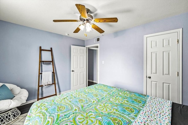 215 Postoffice St Unit 1004, Galveston, TX 77550 - bedroom with visible vents, ceiling fan, and wood finished floors