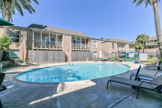 215 Postoffice St Unit 1004, Galveston, TX 77550 - pool featuring fence and a patio area