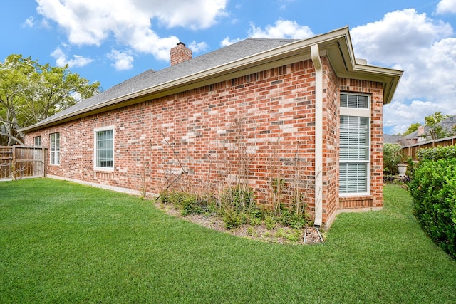 4306 Moss Lake Ct, Richmond, TX 77406 - view of side of home with brick siding, a chimney, and roof with shingles