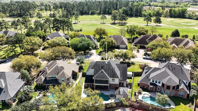 drone / aerial view featuring a residential view and view of golf course
