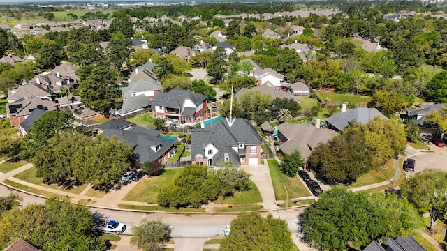 birds eye view of property with a residential view