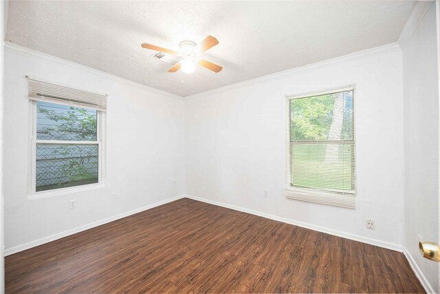 10522 Fairland Dr, Houston, TX 77051 - empty room with dark wood-type flooring, ceiling fan, a healthy amount of sunlight, and crown molding