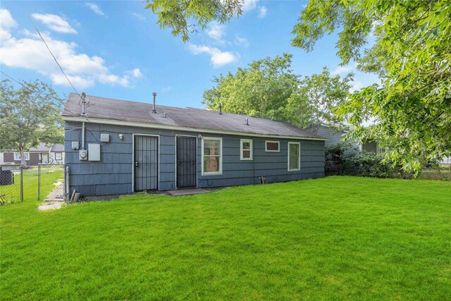 10522 Fairland Dr, Houston, TX 77051 - rear view of house with a gate, fence, and a yard