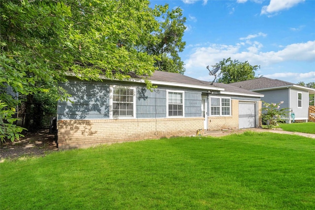 10522 Fairland Dr, Houston, TX 77051 - view of front facade with a front lawn, an attached garage, and brick siding