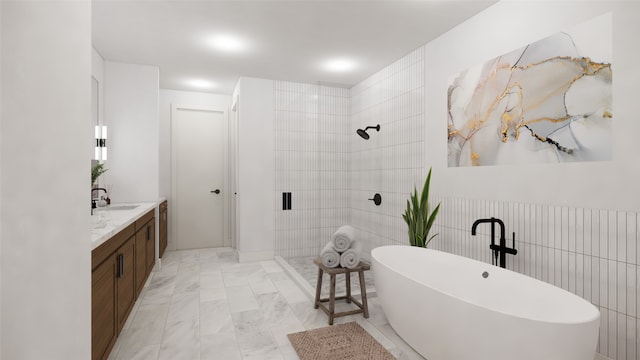 1128 W Pierce St, Houston, TX 77019 - bathroom with a soaking tub, vanity, tiled shower, and marble finish flooring