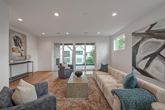 1128 W Pierce St, Houston, TX 77019 - living area featuring recessed lighting, wood finished floors, and baseboards