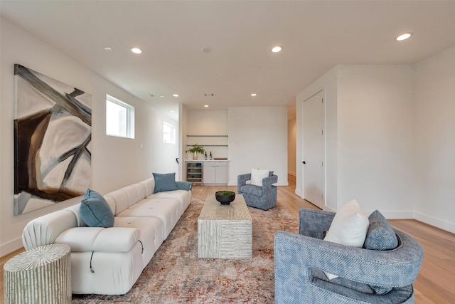 1128 W Pierce St, Houston, TX 77019 - living room featuring beverage cooler, wood finished floors, and recessed lighting