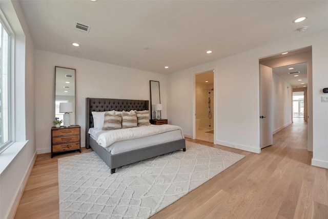 1128 W Pierce St, Houston, TX 77019 - bedroom with light wood finished floors and recessed lighting