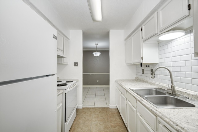 kitchen featuring light countertops, a sink, white appliances, white cabinets, and decorative backsplash