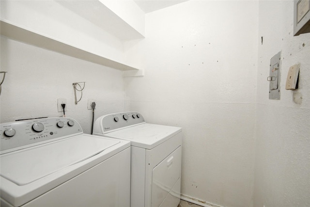 washroom featuring washing machine and clothes dryer and laundry area