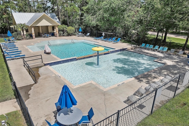 3311 Passage Ln, Conroe, TX 77301 - community pool featuring fence, a patio area, and view of scattered trees