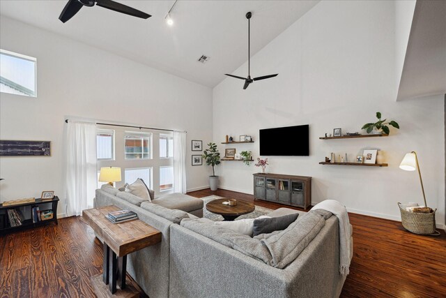 2976 Commerce St, Houston, TX 77003 - living room with a ceiling fan, high vaulted ceiling, healthy amount of natural light, dark wood finished floors, and track lighting
