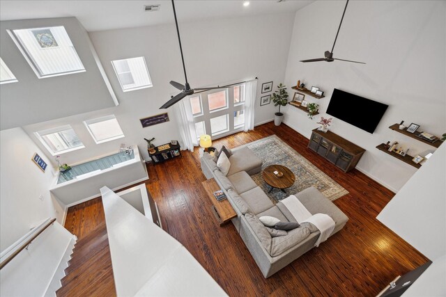 2976 Commerce St, Houston, TX 77003 - living room featuring ceiling fan, high vaulted ceiling, wood finished floors, and healthy amount of natural light