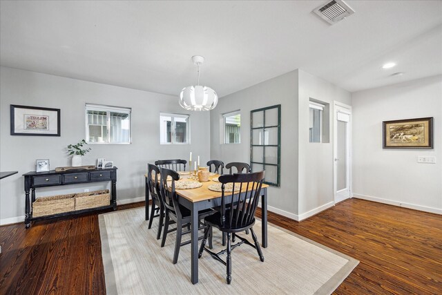 2976 Commerce St, Houston, TX 77003 - dining space with a chandelier, baseboards, wood finished floors, and recessed lighting