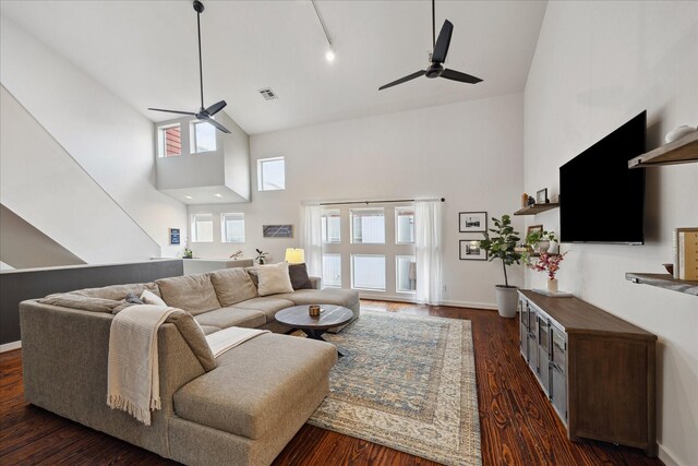 2976 Commerce St, Houston, TX 77003 - living room with a ceiling fan, high vaulted ceiling, dark wood-style flooring, and baseboards