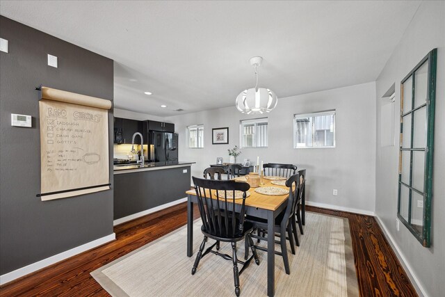 2976 Commerce St, Houston, TX 77003 - dining area with wood finished floors, baseboards, and recessed lighting