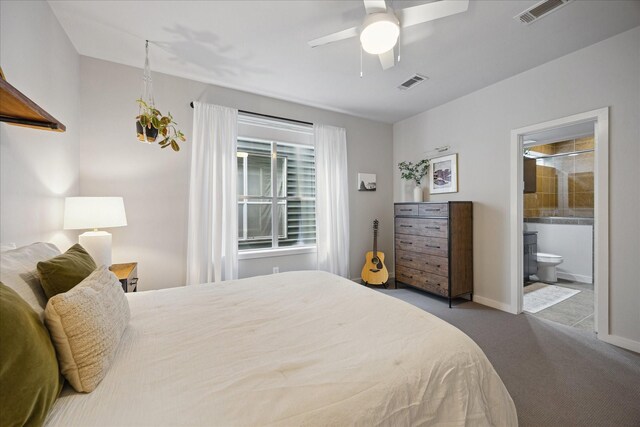 2976 Commerce St, Houston, TX 77003 - bedroom with carpet floors, baseboards, connected bathroom, and ceiling fan