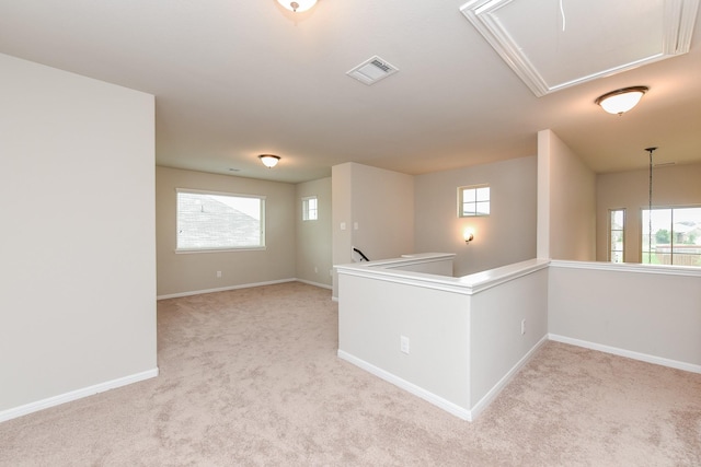 5911 Grantgrala Dr, Katy, TX 77493 - unfurnished room featuring visible vents, plenty of natural light, attic access, and light colored carpet