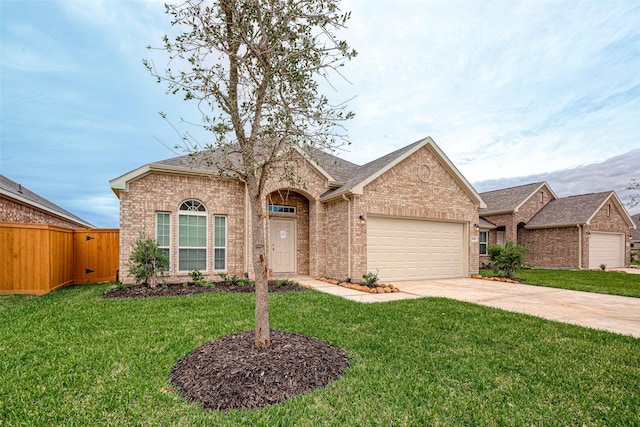 ranch-style house with fence, an attached garage, a front yard, brick siding, and driveway